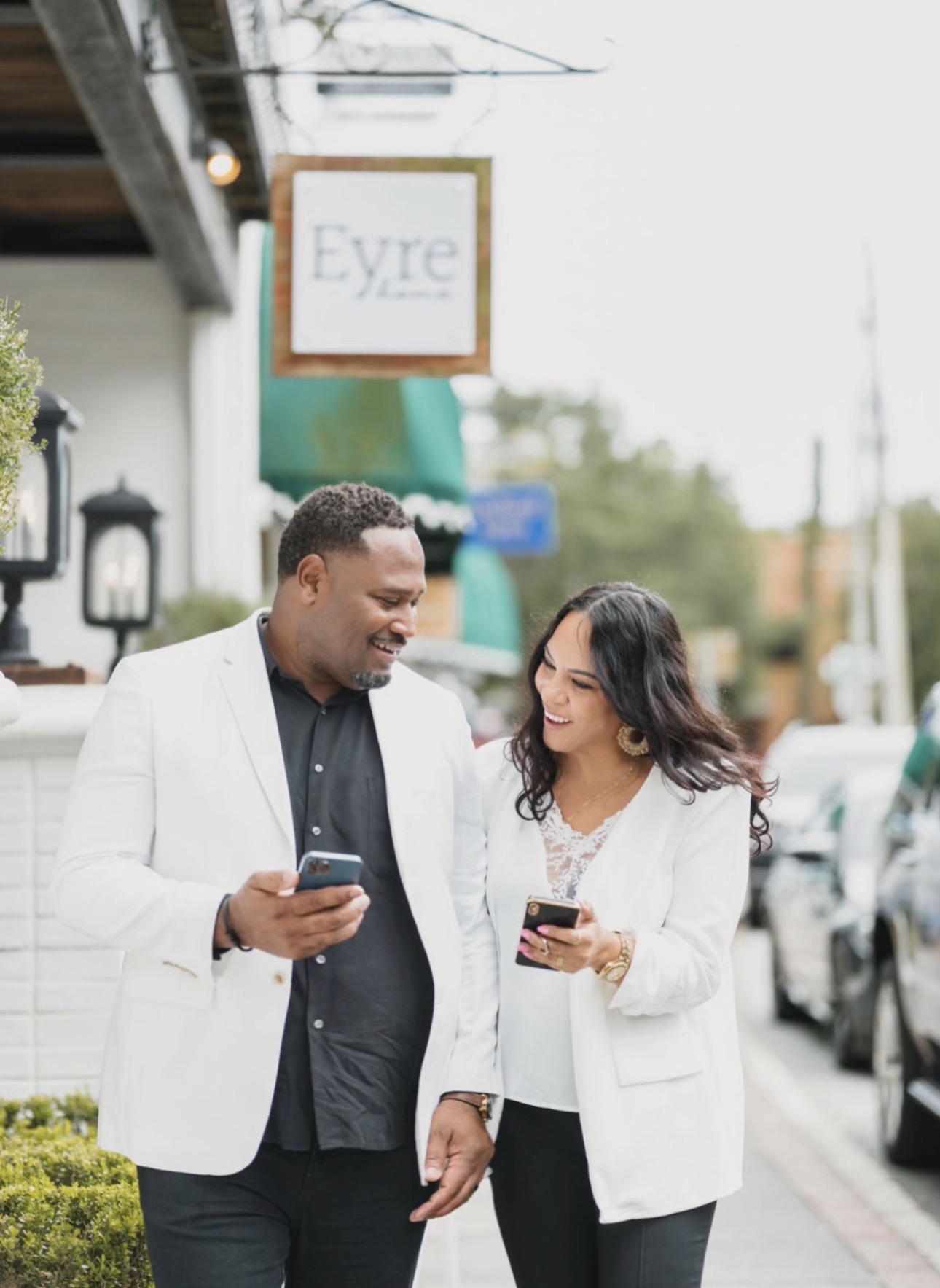 Jevon and Cindy Williams walking a shop-lined sidewalk in Wesley Chapel.